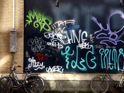 Urban collage: collection street graffiti tags on a nice dark-green background-wall in sunlight and shadow on Hoogtekadijk; photo Amsterdam city; urban photographer Fons Heijnsbroek, 2013 photo