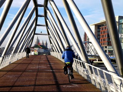 View on the white metal tubings of the modern Oosterdok-bridge - a foot- and bicycle bridge - connecting the Science Center Nemo with the Central Station area in Amsterdam; - urban photography by Fons Heijnsbroek, the Netherlands, 2013 photo