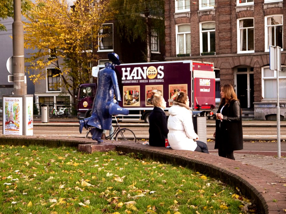 Urban sculpture art of a metallic blue man with hat and no head, along the Marnixstraat, the border of Jordaan district Amsterdam, November 2013; photo Amsterdam city; urban photographer Fons Heijnsbroek, 2013