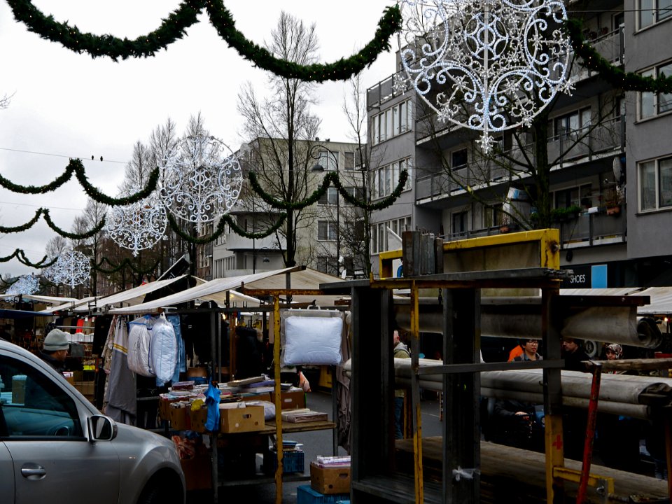 Photo of the Dappermarkt (daily marketplace) in district Amsterdam Oost (East) - on a gray day in December with Christmas lights in the streets; Amsterdam city; - urban photography by Fons Heijnsbroek, the Netherlands, 2013