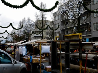Photo of the Dappermarkt (daily marketplace) in district Amsterdam Oost (East) - on a gray day in December with Christmas lights in the streets; Amsterdam city; - urban photography by Fons Heijnsbroek, the Netherlands, 2013 photo