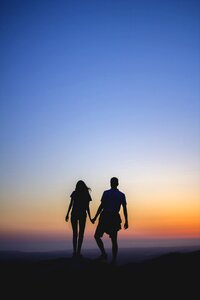 Two together holding hands