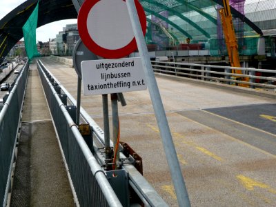 2011.06 - 'A view over the new-built bus-station', looking eastward,in with the bowed glass-roof and with the concrte metro tunnel underground, direction behind Central Station Amsterdam - east-side of the station; urban photography, Fons Heijnsbroek photo