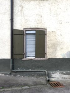 Window, wall and downpipe photo