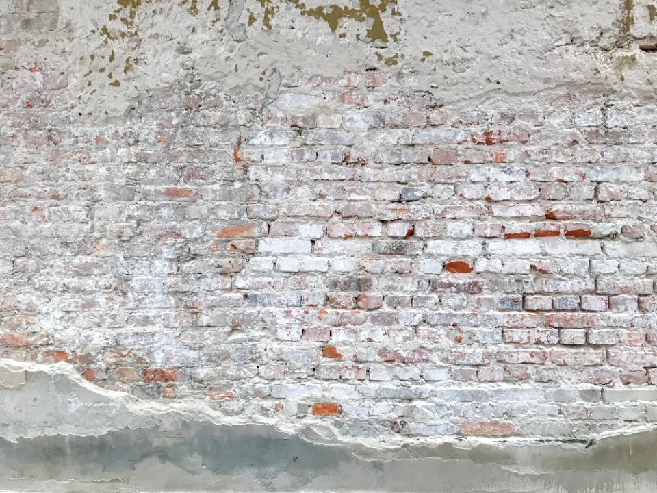 Old plastered brick wall