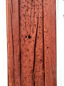 Old wood beam painted in red photo