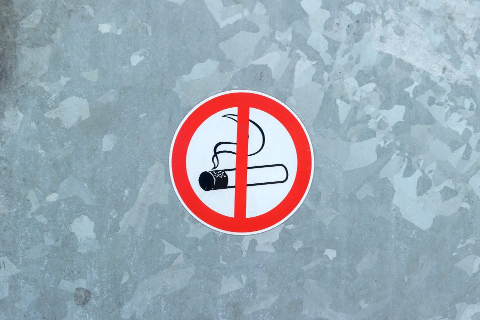 No smoking sign on metal background