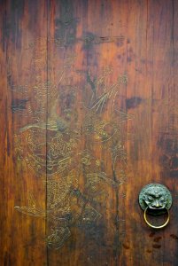 Chinese wooden door with lion grip