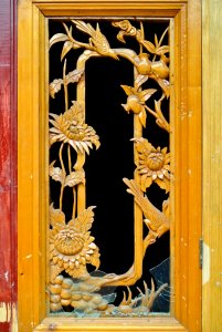 Wooden window frame carving flower design photo