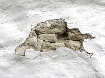 White mud wall with opening photo