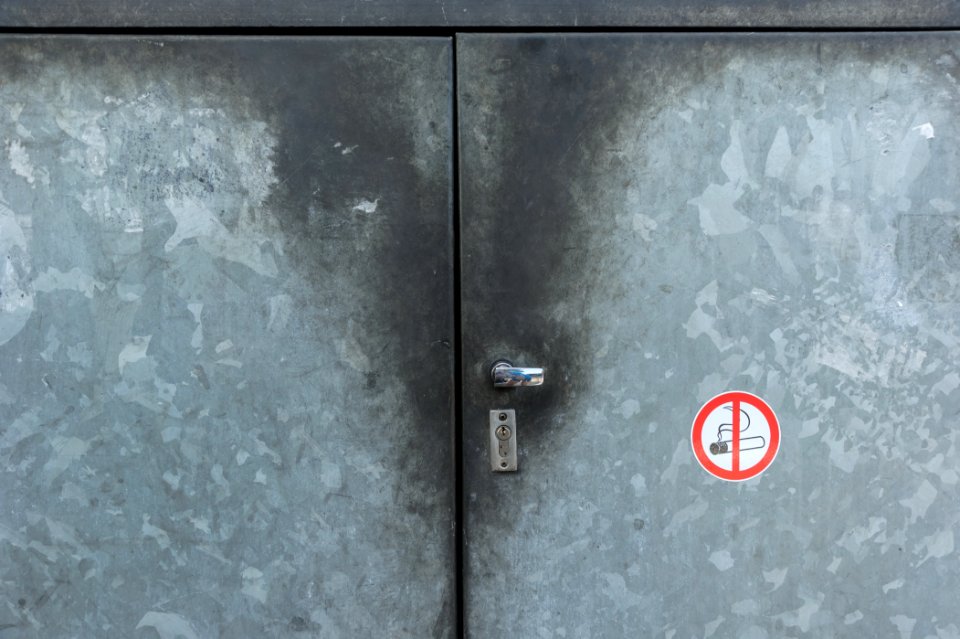 No smoking sign on metal background