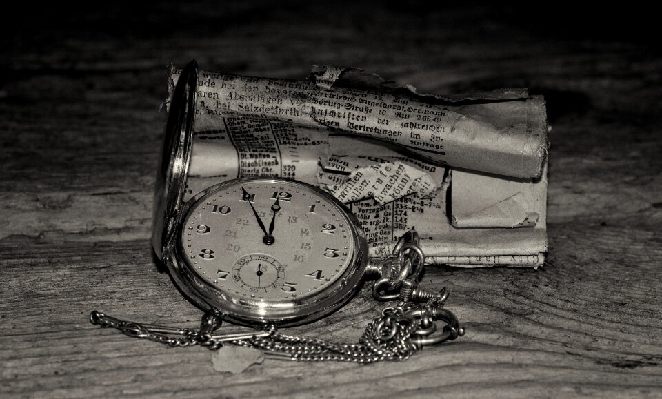 Gold clock face newspaper