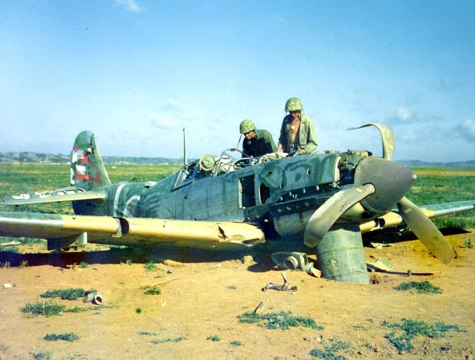 Marines look over abandoned Japanese Kawasaki Ki-61