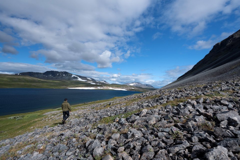 A ranger walks near the shore of Mirror Lake in the Katmai Preserve NPS Photo/Russ Taylor