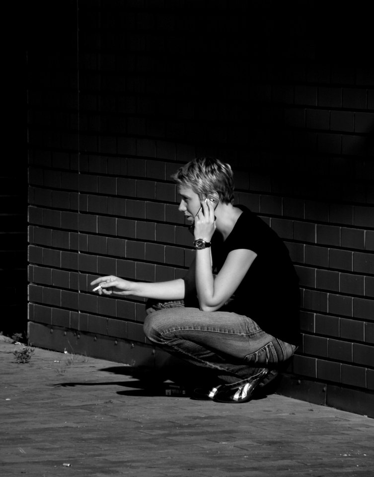 Smoking Woman Making a Phone Call