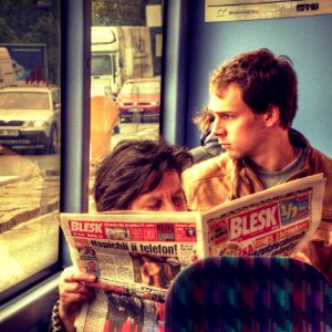 Woman Reading a Tabloid in the Bus 2 photo