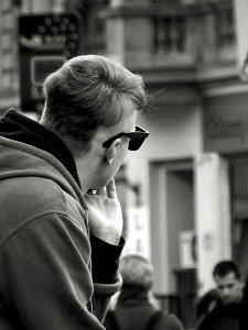 Young Man Sitting on Balustrade B&W