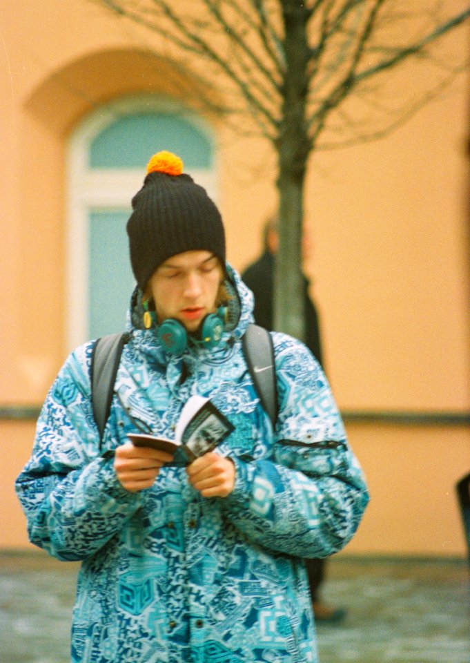 Ricoh TLS 401 + Pentacon Electric 4/200 MC - Young Man at Tram Stop (taken from tram window)