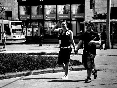 Couple Trying to Catch a Tram