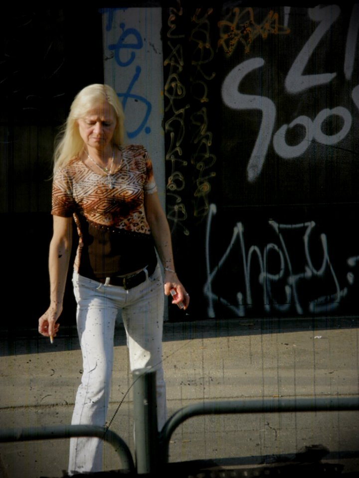 Woman Dropping a Cigarette Butt