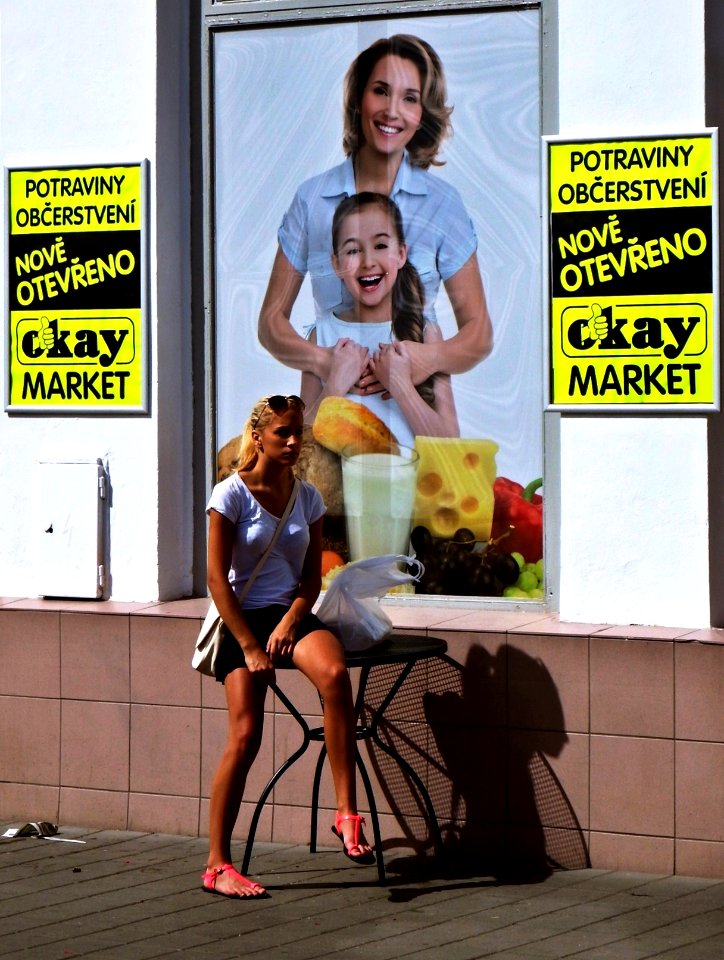Young Woman in front of Newly Opened Shop