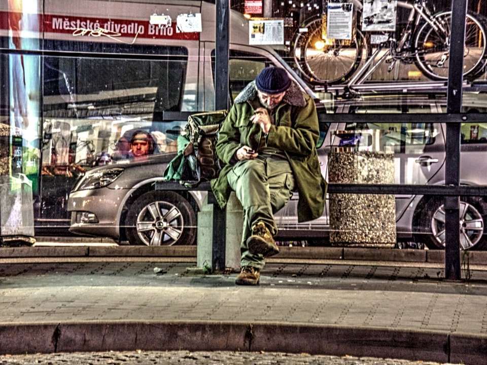 Man Texting at Night Bus Stop - HDR Processed 1