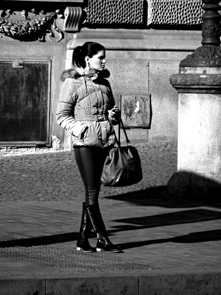 Young Woman at Tram Stop