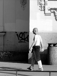 Young Man with Clenched Fists Is Entering the Shadow