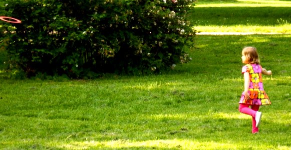Little Girl Playing Frisbee