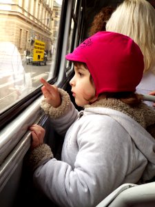 Little Girl Looking from Tram Window photo