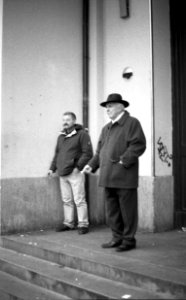 Praktica BC1 - Men Standing in front of Railway Station photo