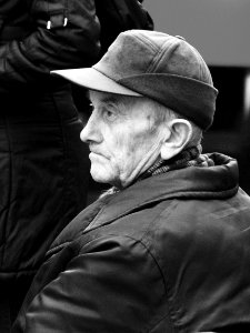 Old Man at Tram Stop Bench 2
