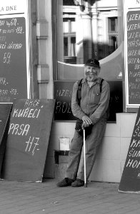 Another Man Hanging Around In Front Of Butcher Shop photo