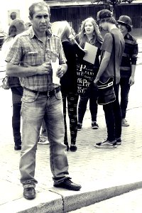 Man and Group of Teenagers (BW)