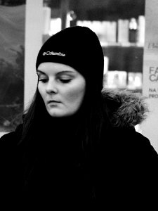 Pensive Young Woman at Tram Stop photo