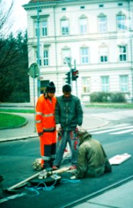 Praktica BC1 - Man Working on a Sewer (taken through colored tram window)