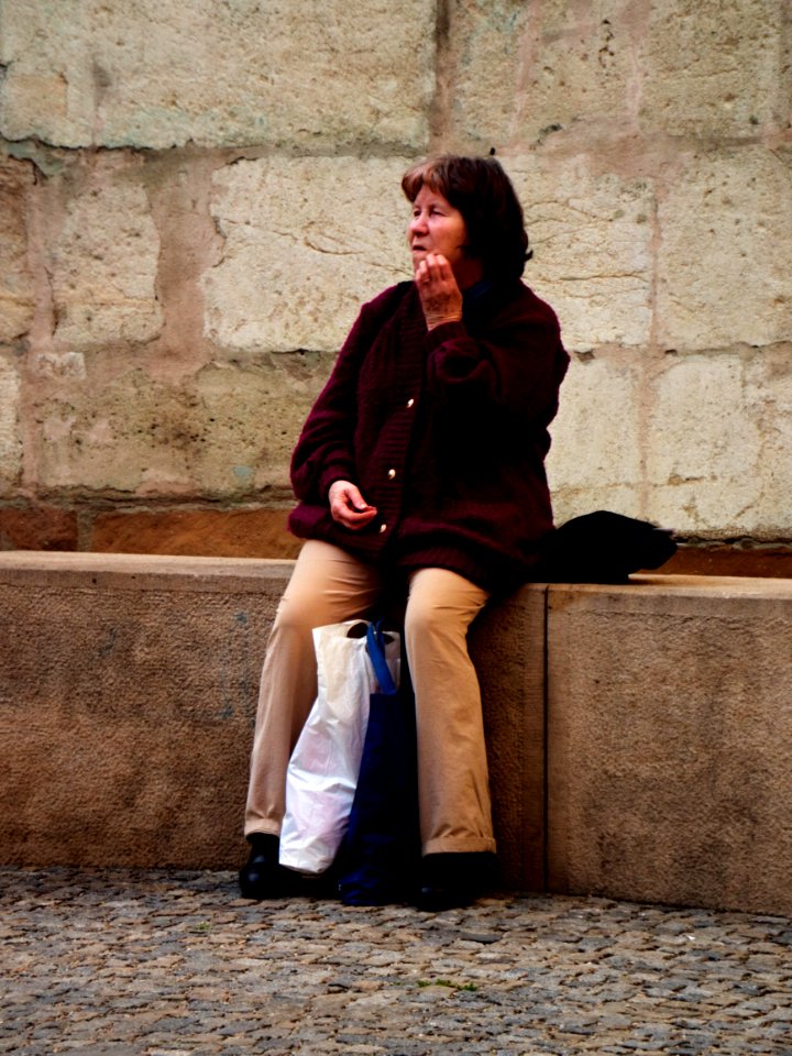 Woman Sitting at the St. Jacob's Church