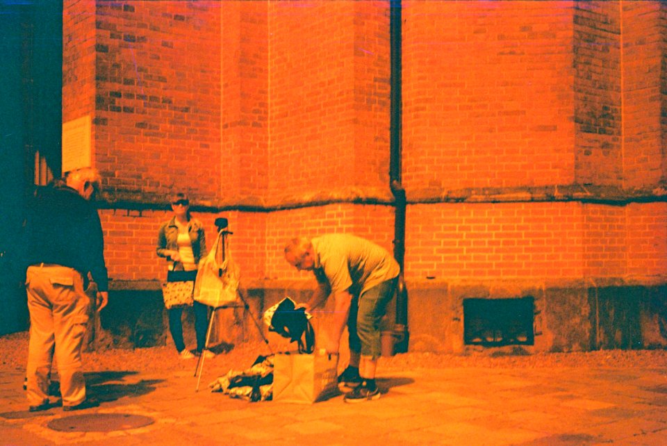 Pentacon Electra + redscale film - Photographer in front of the Red Church 1