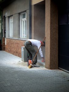 Man Working in front of His House photo