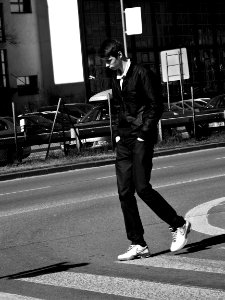 Young Man Lost in Thoughts on Crosswalk