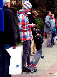 Colourful Skateboardist on Bus Stop photo