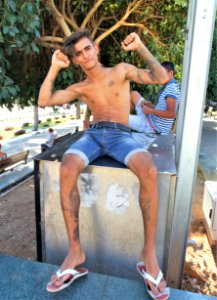 Skinny Guy showing Muscles