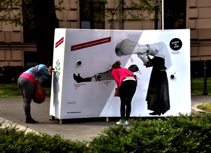Young Woman Examining Creative Advertisment