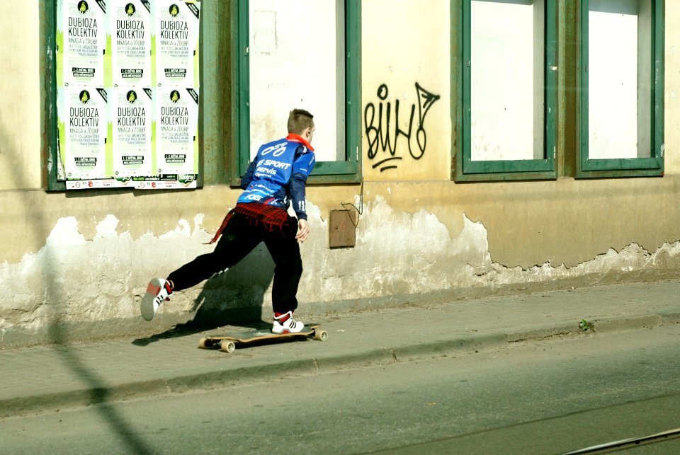 Sony Alpha A230 with Helios-44-2 - Skateboarder Leading to God (the graffiti says "Bůh", Czech word for "God")