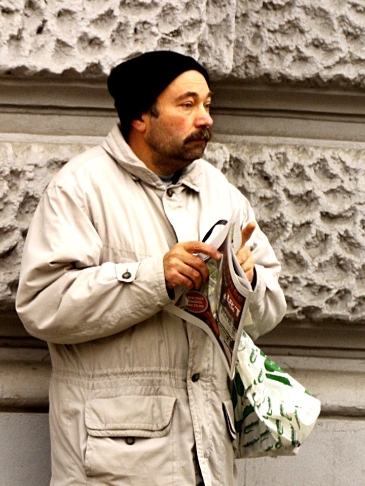 Man with Advertising Newspaper
