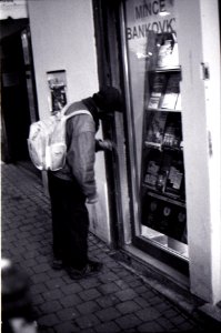 Praktica BC1 - Man Looking at Numismatist Shop Window