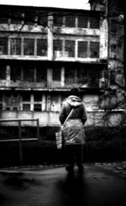 Canon Rebel XS + ORWO DP3 film - Woman Looking at Abandoned Factory