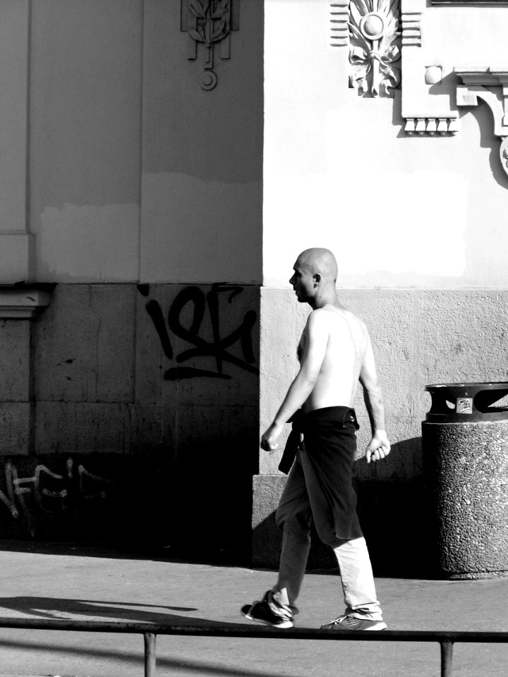 Young Man with Clenched Fists Is Entering the Shadow