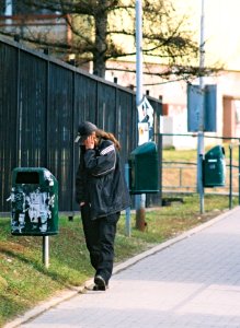 Praktica MTL 5 + Pentacon Electric 4/200 MC - Man Looking at a Garbage Can photo