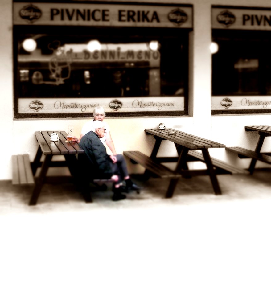 Elderly Couple in front of a Pub